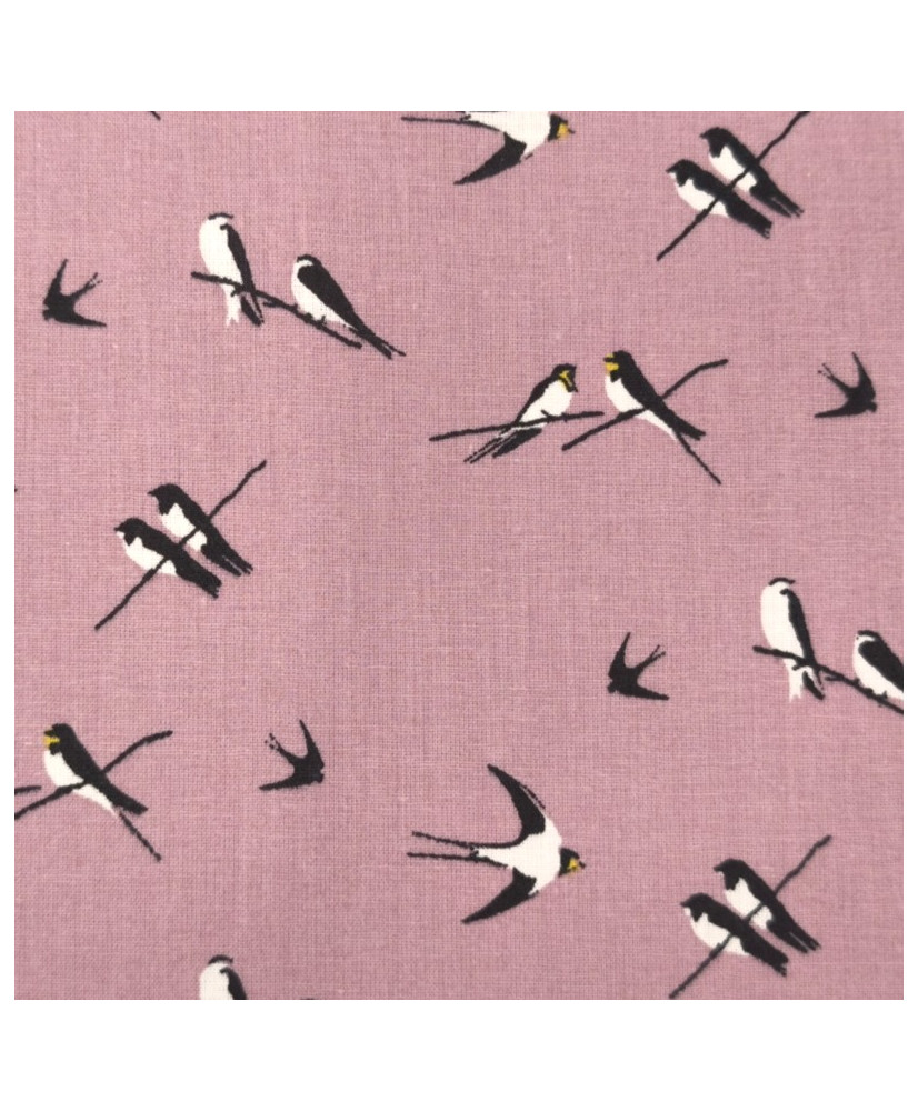 Tissu 100 % coton “Hirondelles” – Motif oiseaux noir et blanc fond rose