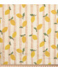 Tissu double gaze de coton blanc cassé avec motifs citrons jaunes et fines rayures verticales ocre.